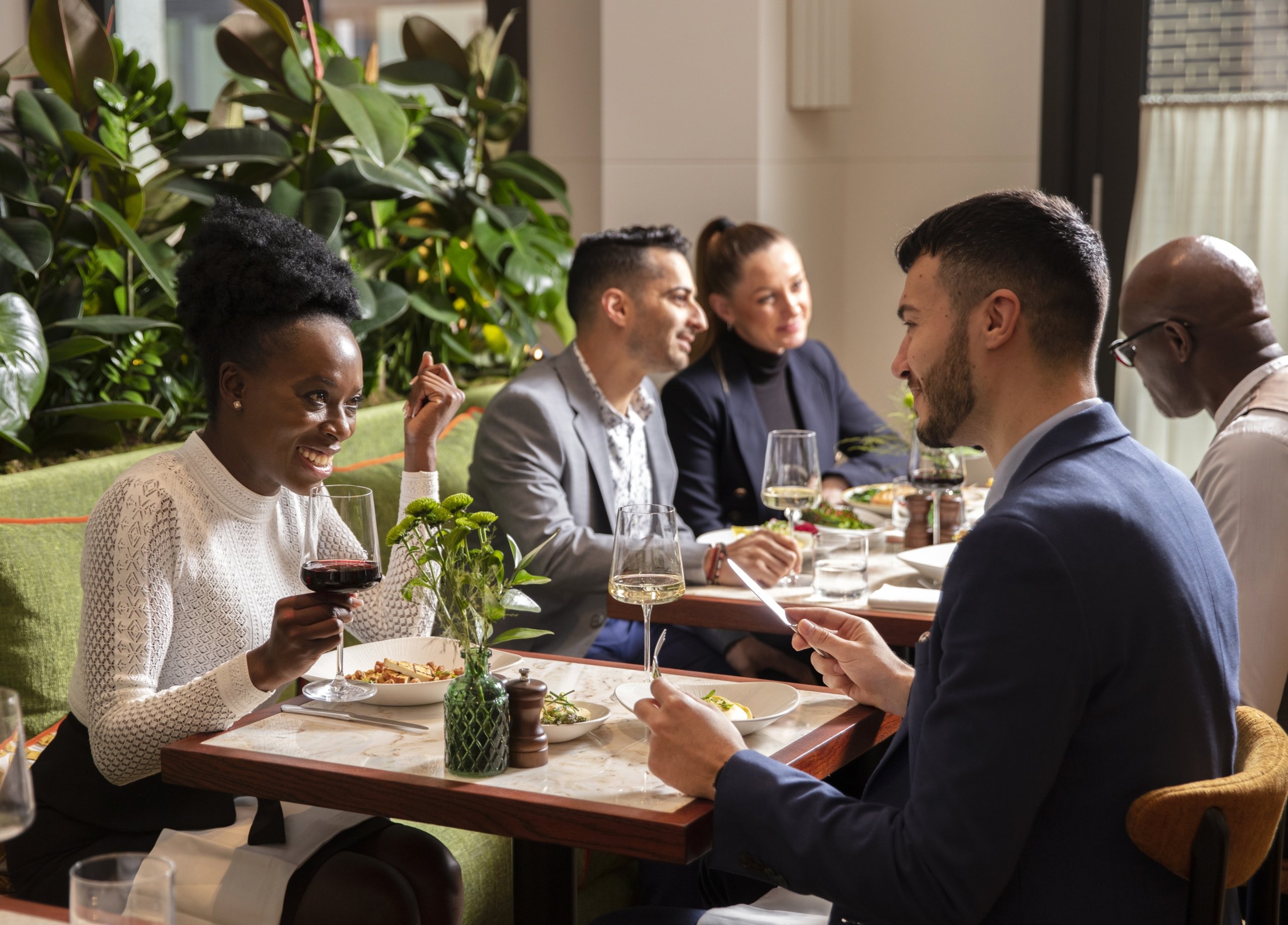 People sitting in a restaurant having a conversation