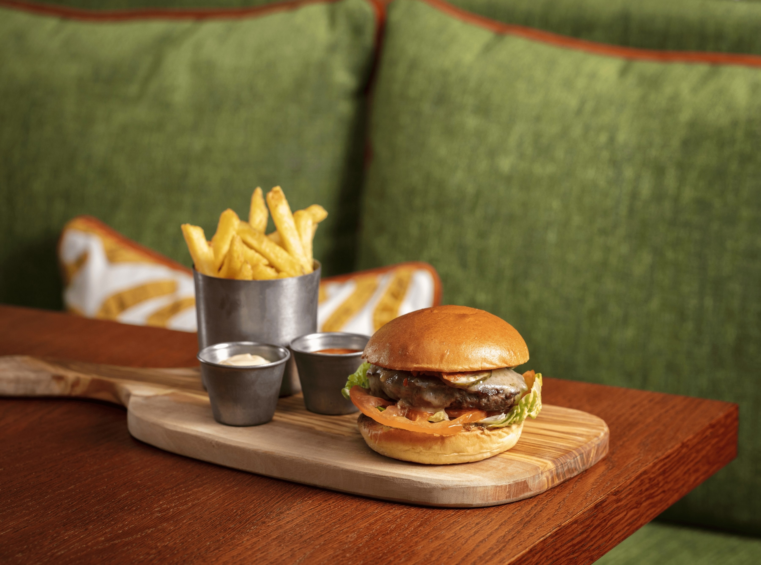 Platter with burger and fries on a table
