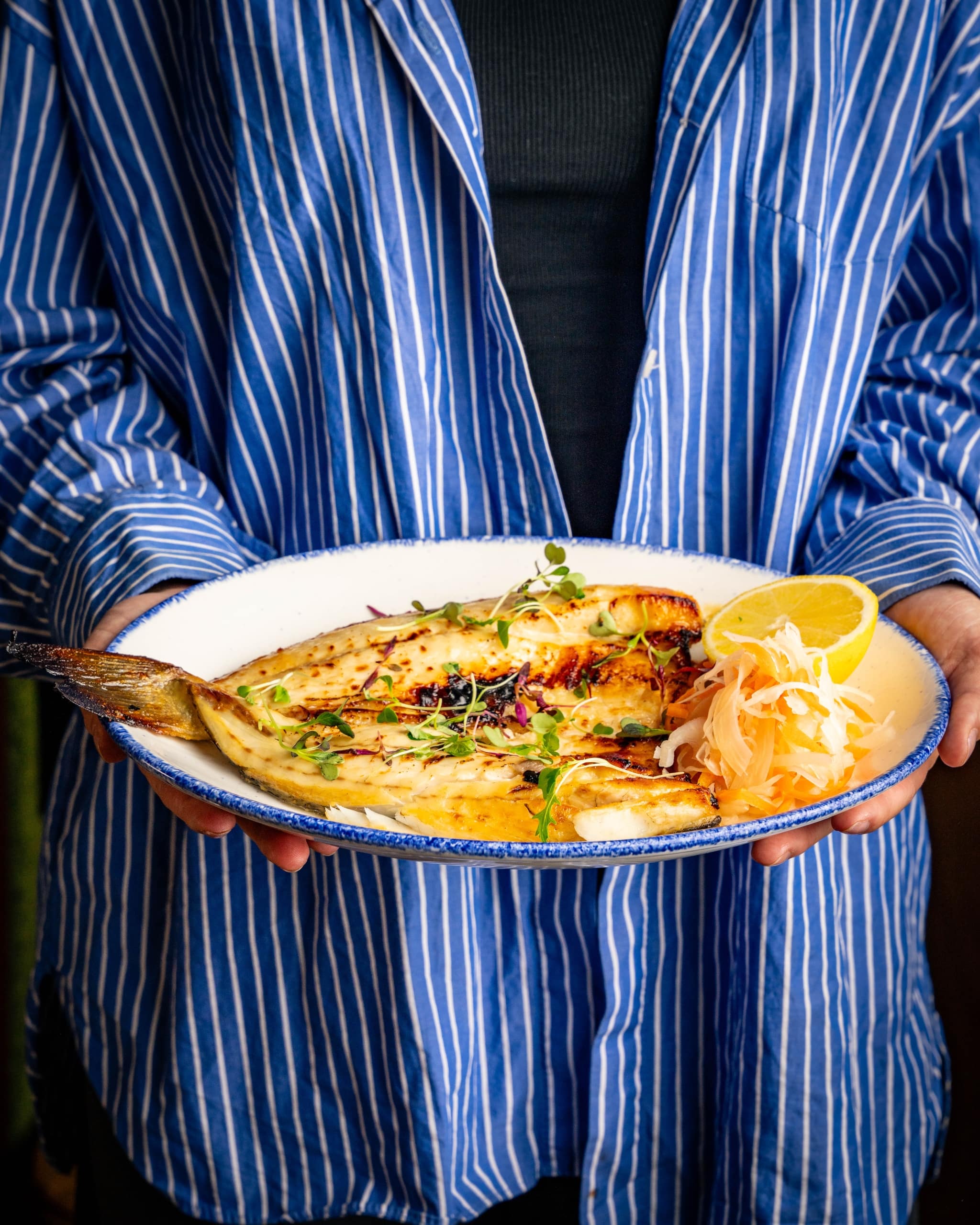 Fish on a plate prepared by The Cardinal