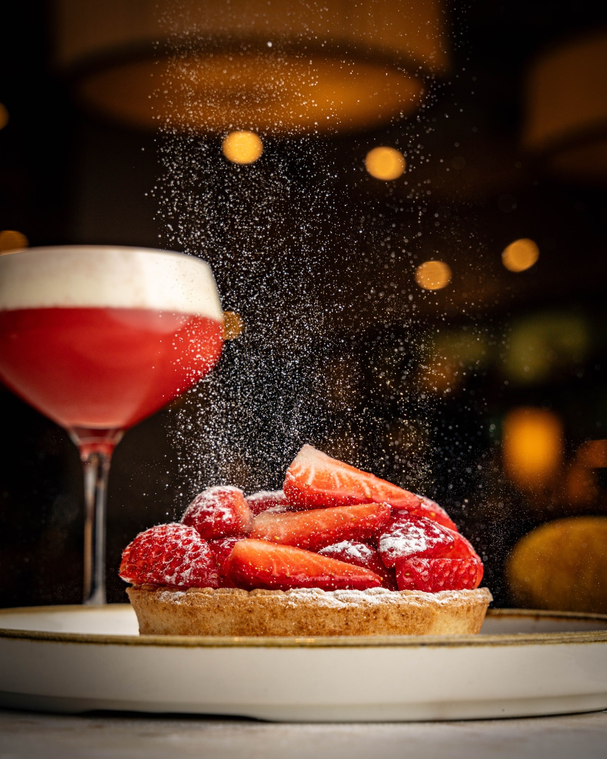 Strawberry desert with icing sugar on top