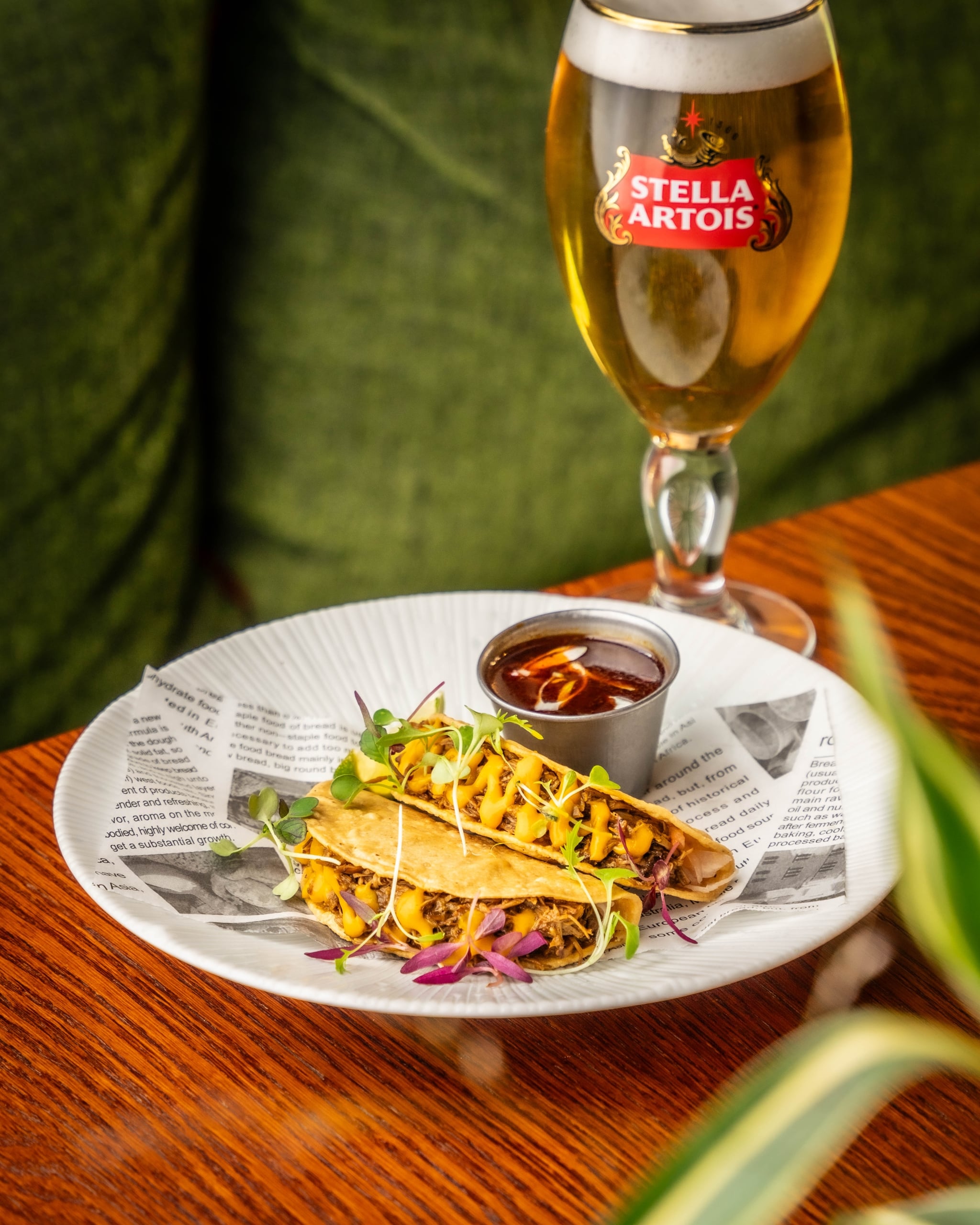 Plate of tacos prepared by The Cardinal with a glass of Stella Artois