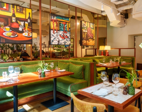 The Cardinal dining room with art work in the background