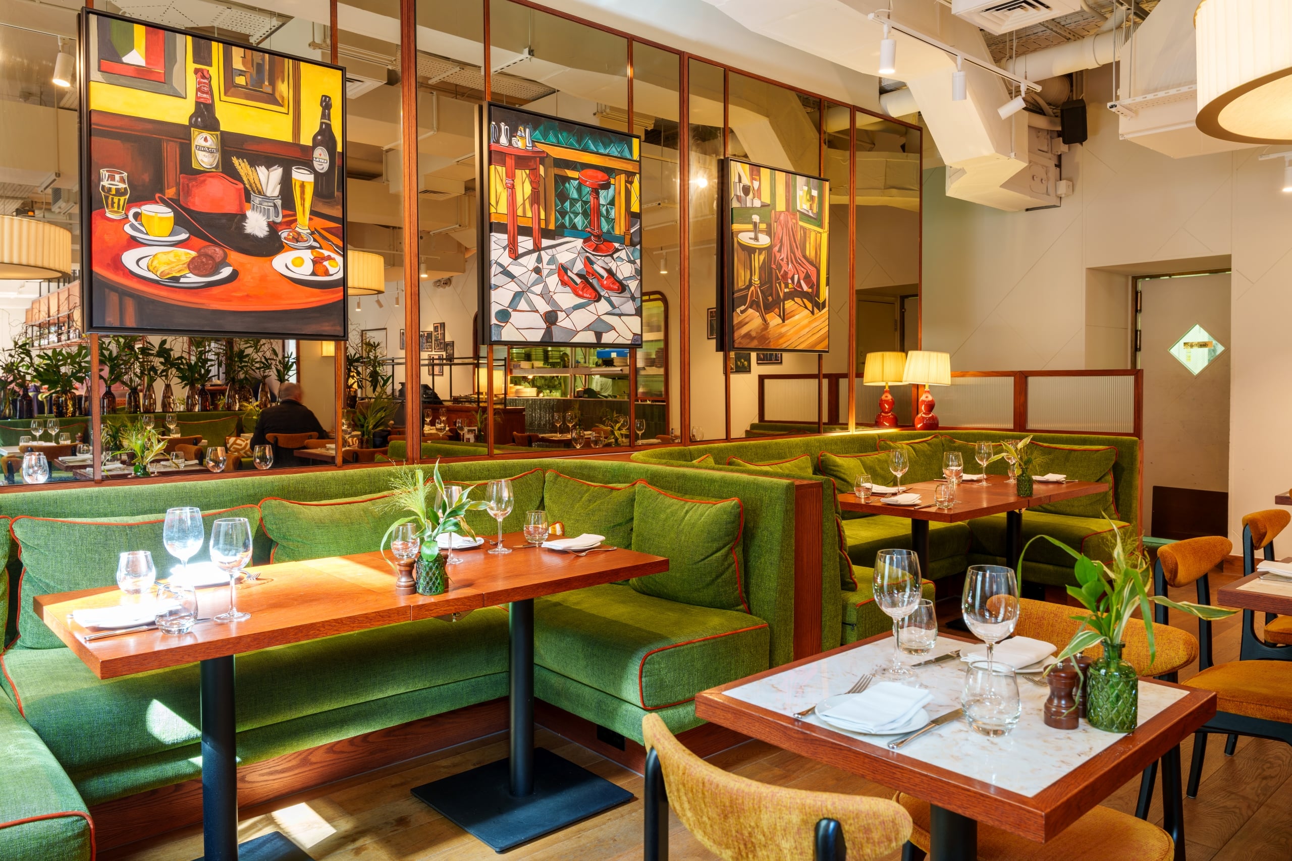 The Cardinal dining room with art work in the background