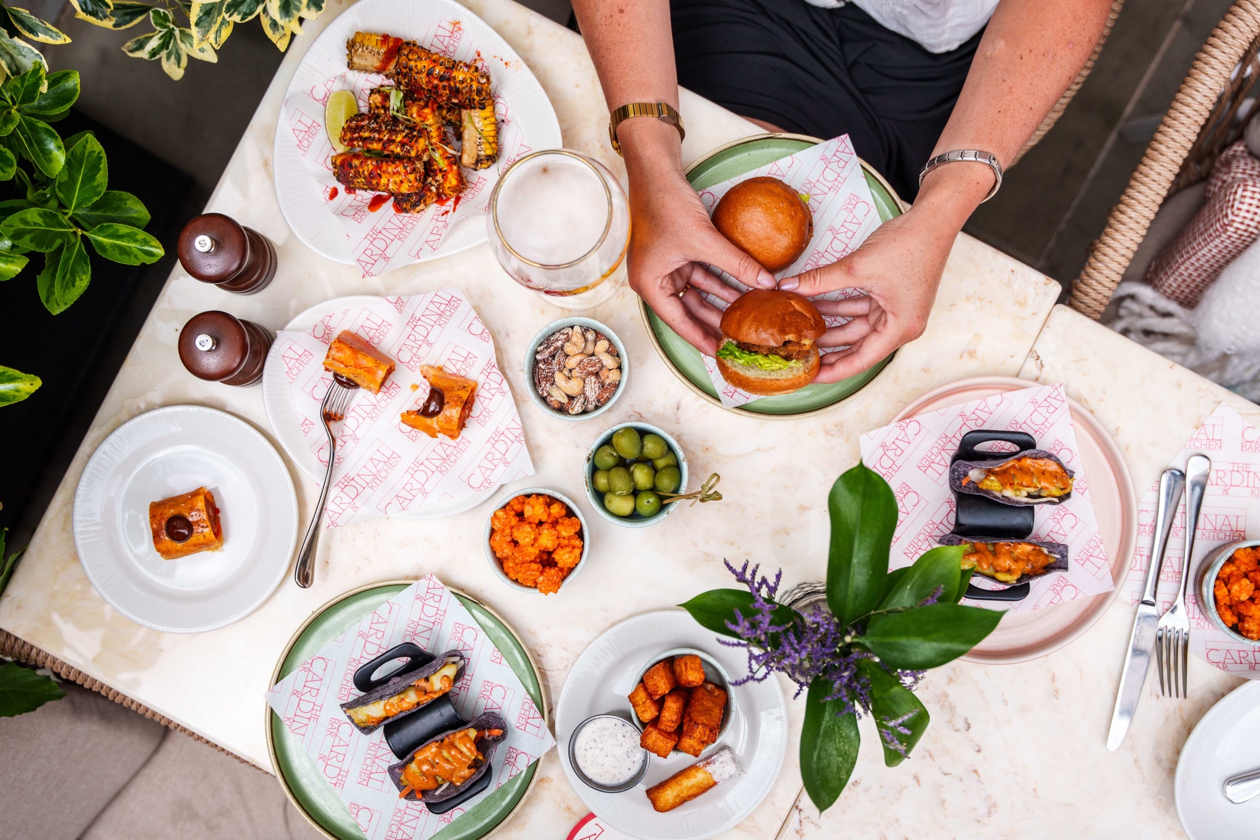 The Cardinal Bar & Kitchen large table of food